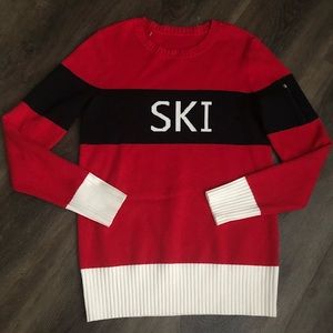 New! Beautiful fashion statement sweater. Zipper on a sleeve.